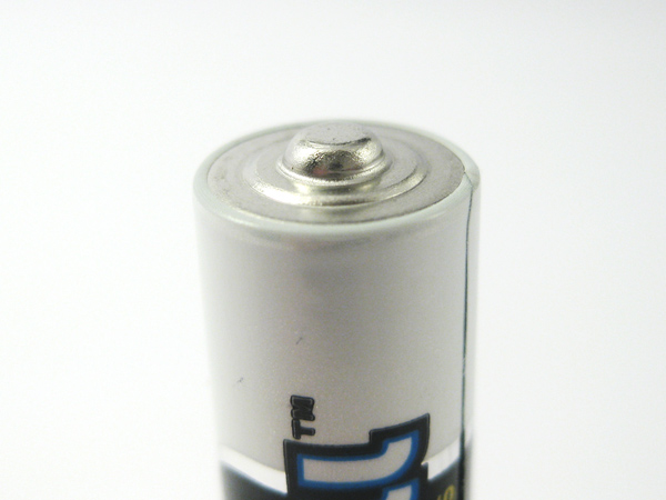 Non-rechargeable battery rounder positive terminal
