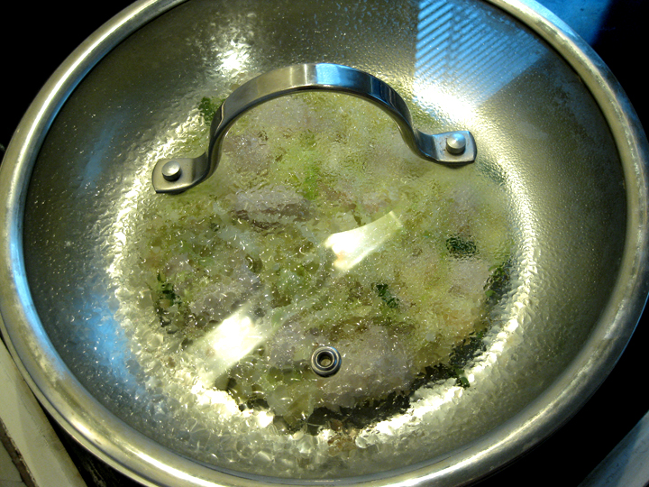 Cover with lid to cook okonomiyaki